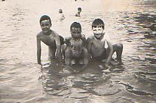 John, Colin and Mark Weightman with
Arthur Collins at front in Winn's Common
paddling pool c.1949. Photo: Colin Weightman